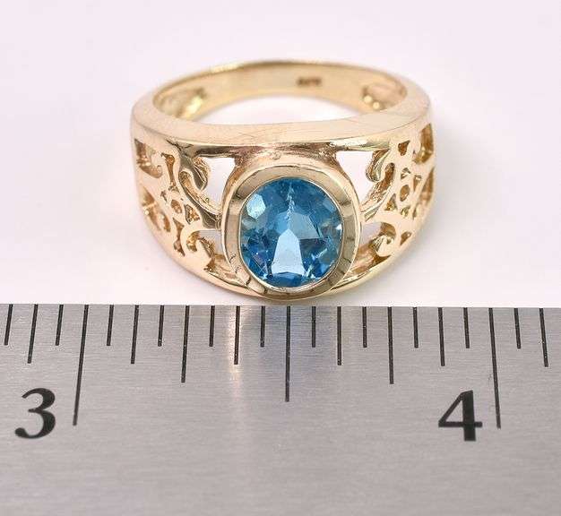 Sturdy Blue Topaz Ring In Yellow Gold