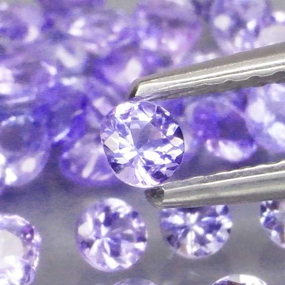 Heavy flashing 4.22ct diamond cut Tanzanite set
