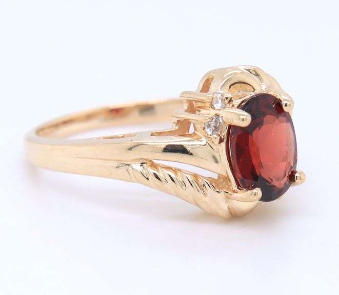 Handsome Yellow Gold oval Garnet and Diamond Ring
