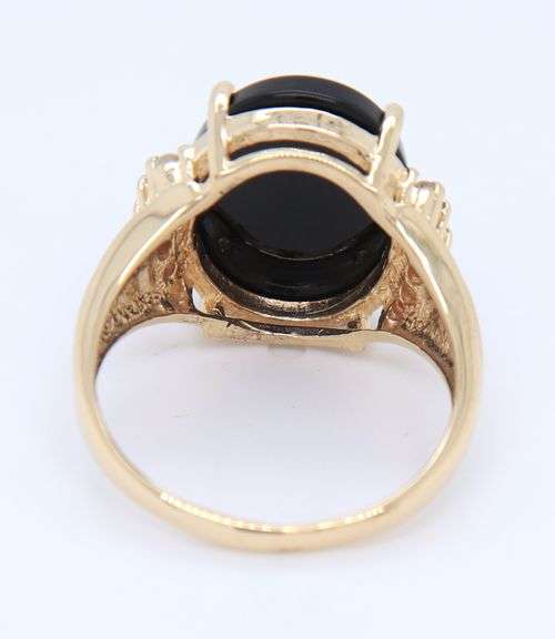 Attractive Black Onyx and Diamond Accent Ring in Yellow Gold