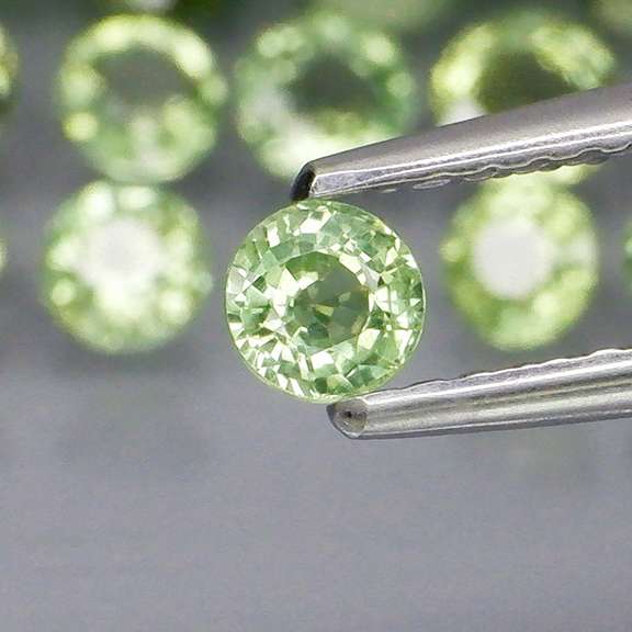 Fantastic 6.47ct diamond cut GREEN Sapphire set