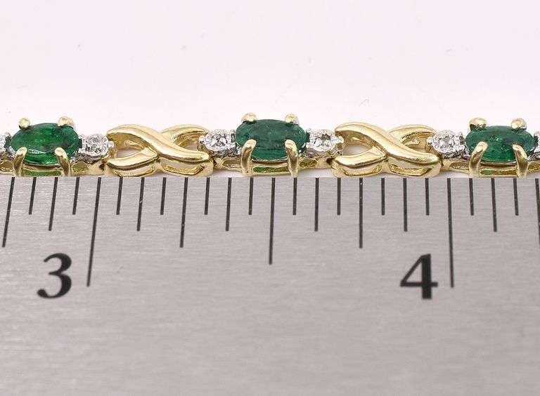 Exquisite Emerald And Diamond X And O Bracelet In Yellow Gold