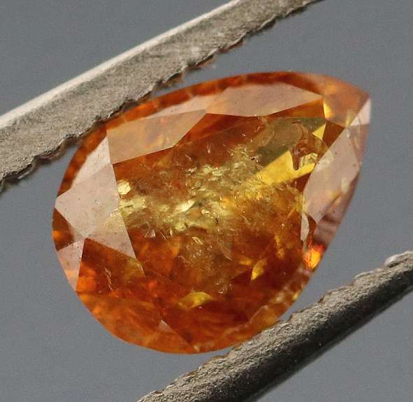 One of a kind! .33ct amber Diamond