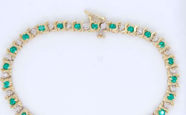 Wonderful Synthetic Emerald and Diamond S Link Bracelet in Yellow Gold