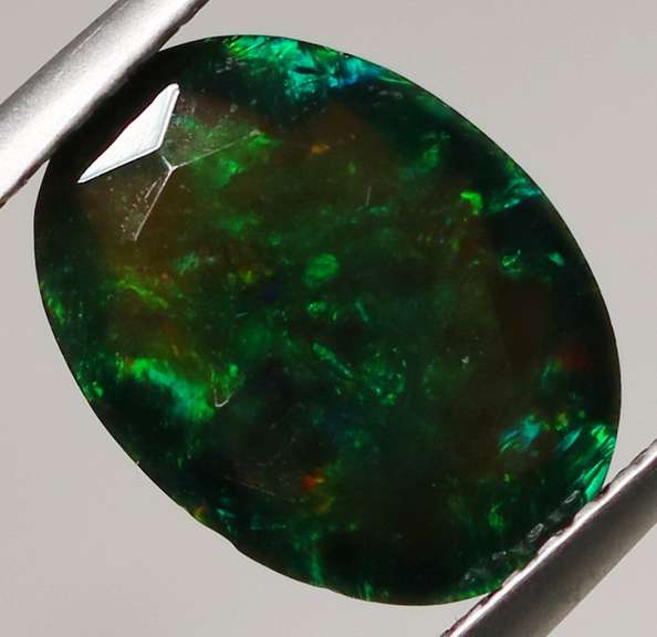 Smoldering flashing 1.85ct black Opal