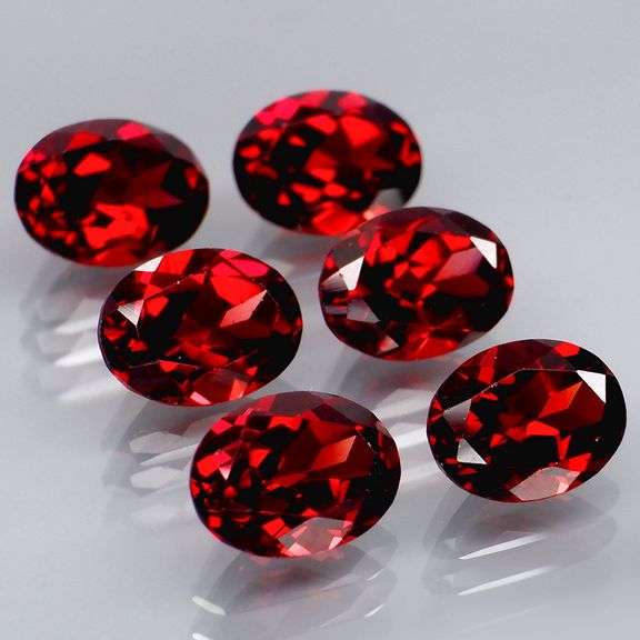 Amazing 9.10ct oval cut cherry red Garnet set