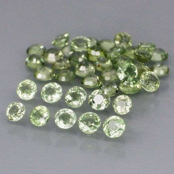 Awesome 4.95ct diamond cut GREEN Sapphire set