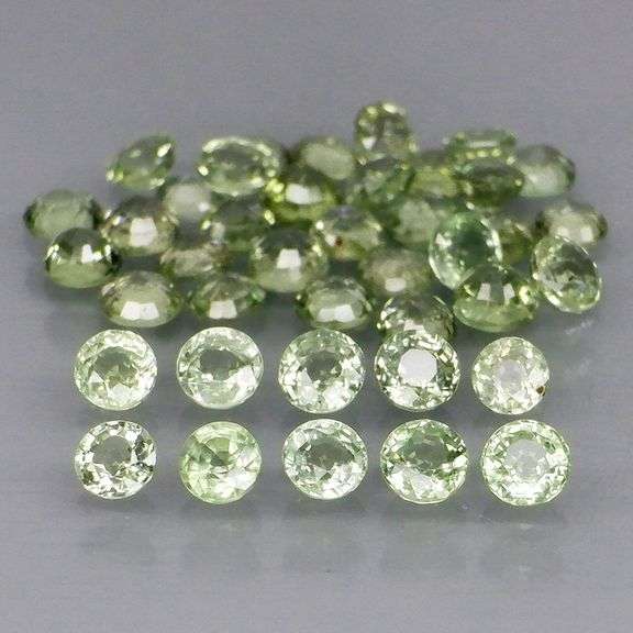 Awesome 4.95ct diamond cut GREEN Sapphire set