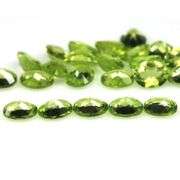 Fantastic 8.42ct 5x4mm oval cut Peridot set
