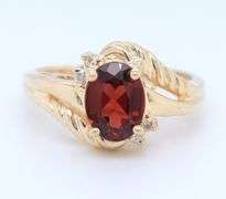 Handsome Yellow Gold oval Garnet and Diamond Ring