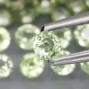 Awesome 4.95ct diamond cut GREEN Sapphire set