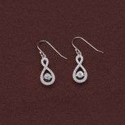 Infinite earrings in platinum over 925 sterling silver with center stone dancing