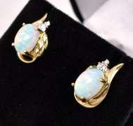 Dazzling Opal Stud Earrings In Yellow Gold