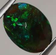 Smoldering flashing 1.85ct black Opal