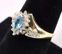 Elegant Blue Topaz And Diamond Ring In 14K Yellow Gold
