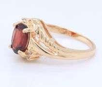 Handsome Yellow Gold oval Garnet and Diamond Ring