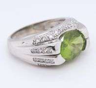 Charming White Gold oval Peridot and Diamond Ring
