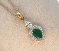 10K GOLD PENDANT WITH EMERALD AND DIAMONDS