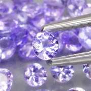Heavy flashing 4.22ct diamond cut Tanzanite set