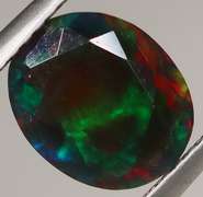 Rainbow flashing! 1.24ct black Opal