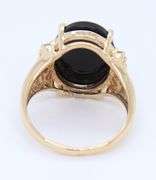 Attractive Black Onyx and Diamond Accent Ring in Yellow Gold
