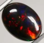 Block flashing 3.12ct black Opal cabochon