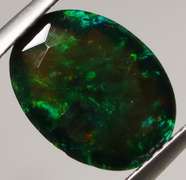 Smoldering flashing 1.85ct black Opal