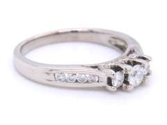Attractive White Gold Three Stone Channel Set Diamond Shank Engagement Ring