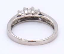 Attractive White Gold Three Stone Channel Set Diamond Shank Engagement Ring