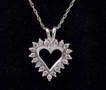 Elegant Heart Diamond Pendant In 14K White Gold