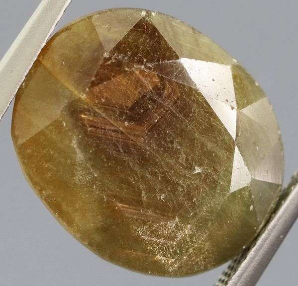 Shimmering metallic 15.64ct earth toned faceted Sapphire