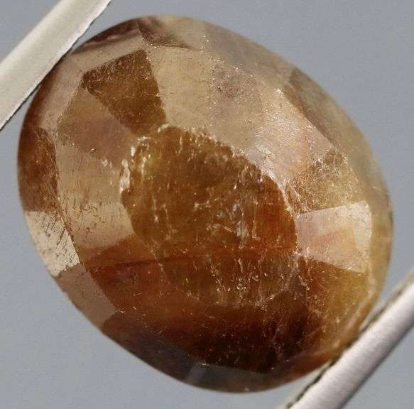 UNTREATED! Shimmering 9.10ct earth toned faceted Sapphire
