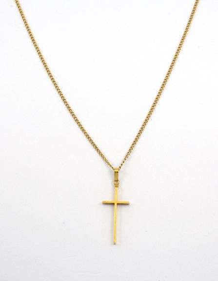 Tasteful Small Cross Pendant on Necklace