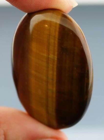 Look at that shimmer! 79.91ct Golden Tiger Eye cabochon