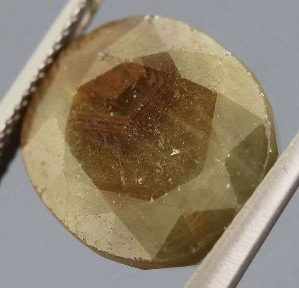Shimmering metallic 15.64ct earth toned faceted Sapphire