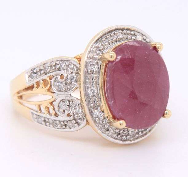 Charming Yellow Gold Oval Ruby and Diamond Halo Ring