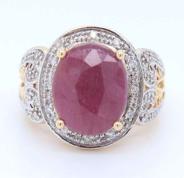 Charming Yellow Gold Oval Ruby and Diamond Halo Ring