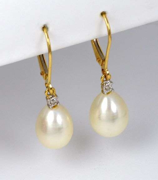 Feminine Lever Back Pear Shaped Pearl Earrings