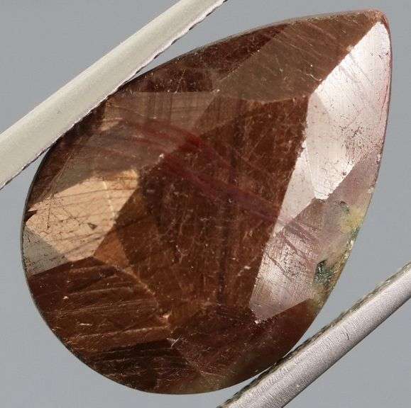 Shimmering metallic 10.84ct earth toned faceted Sapphire