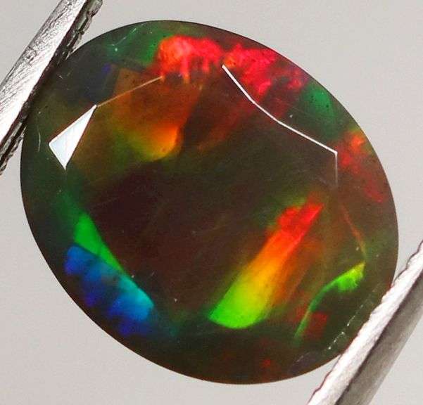Fully faceted full panel flashing 1.64ct oval cut Black Opal