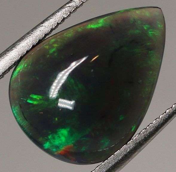 Silky black with blue and green flashing 1.34ct Black Opal cabochon