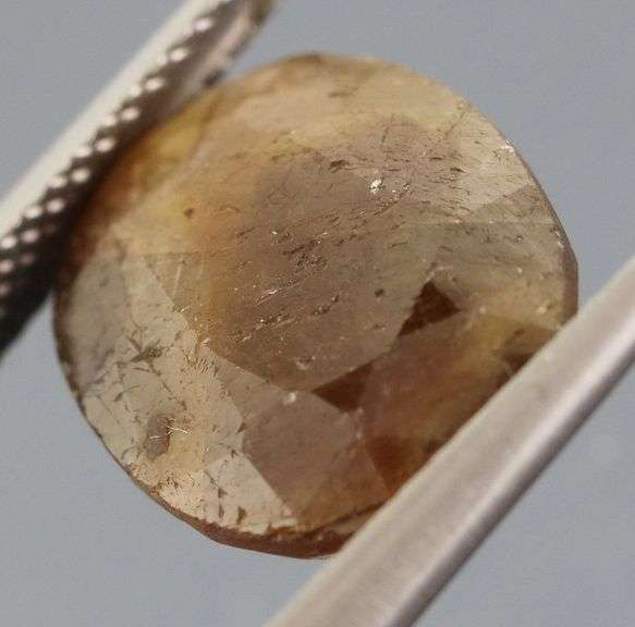UNTREATED! Shimmering 9.10ct earth toned faceted Sapphire