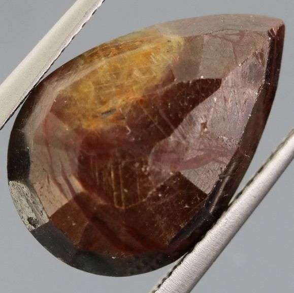 Shimmering metallic 10.84ct earth toned faceted Sapphire