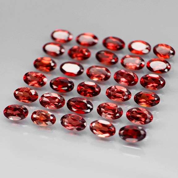 Amazing 8.48ct oval cut cherry red Garnet set