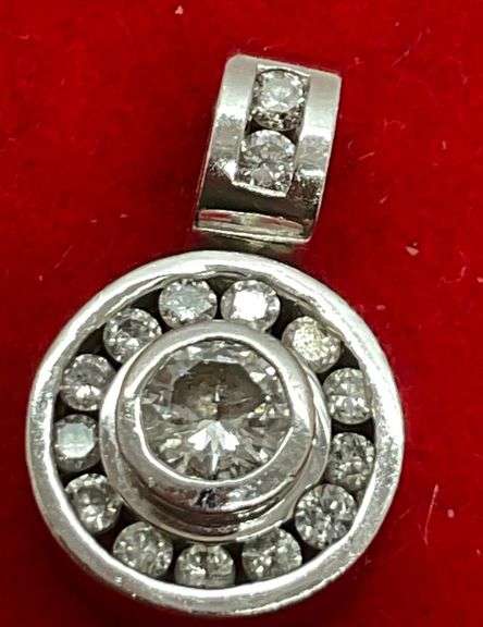 14K WHITE GOLD AND DIAMOND PENDANT.
