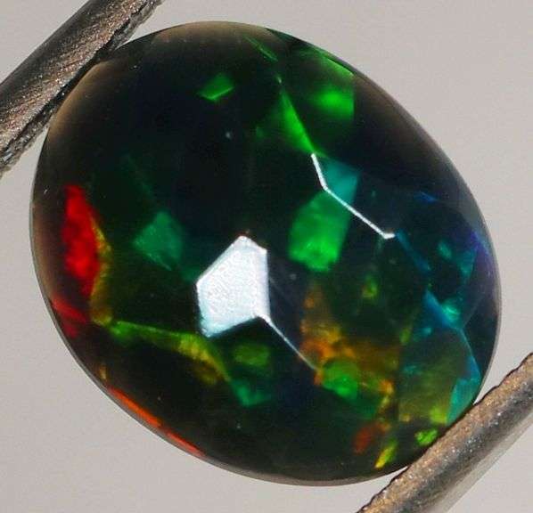 Glittering multi pattern flashing 1.43ct Welo black Opal