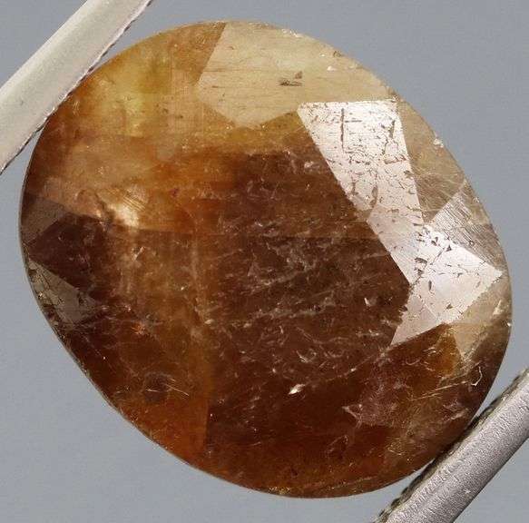 UNTREATED! Shimmering 9.10ct earth toned faceted Sapphire