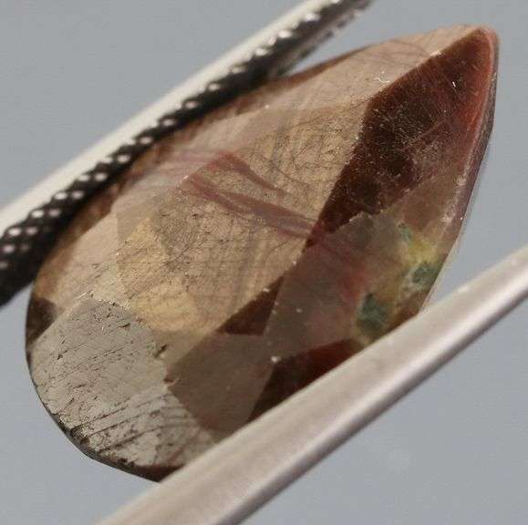Shimmering metallic 10.84ct earth toned faceted Sapphire
