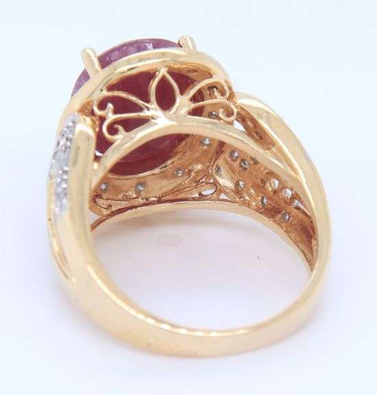 Charming Yellow Gold Oval Ruby and Diamond Halo Ring