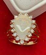 CERTIFIED BRAND NEW LADIES 14KT GOLD, OPAL, AND CZ RING
